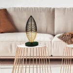 قطعة أثاث فينة من المعدن على شكل ورقة على حامل خشبي